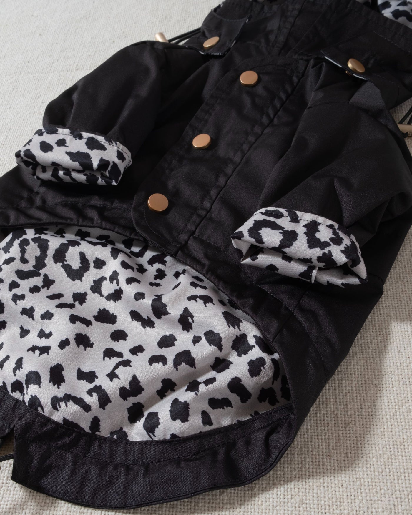black dog raincoat with leopard print lining and removable hood