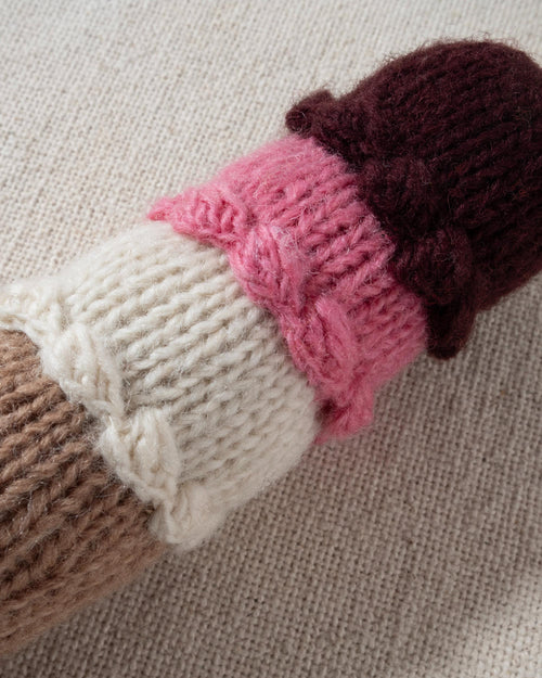 Cute hand-knit ice cream dog toy with three colorful scoops, designed for interactive play and fun.