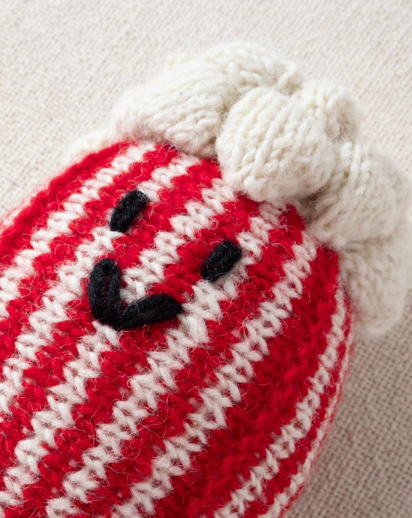 red and white hand knit crochet popcorn dog toy