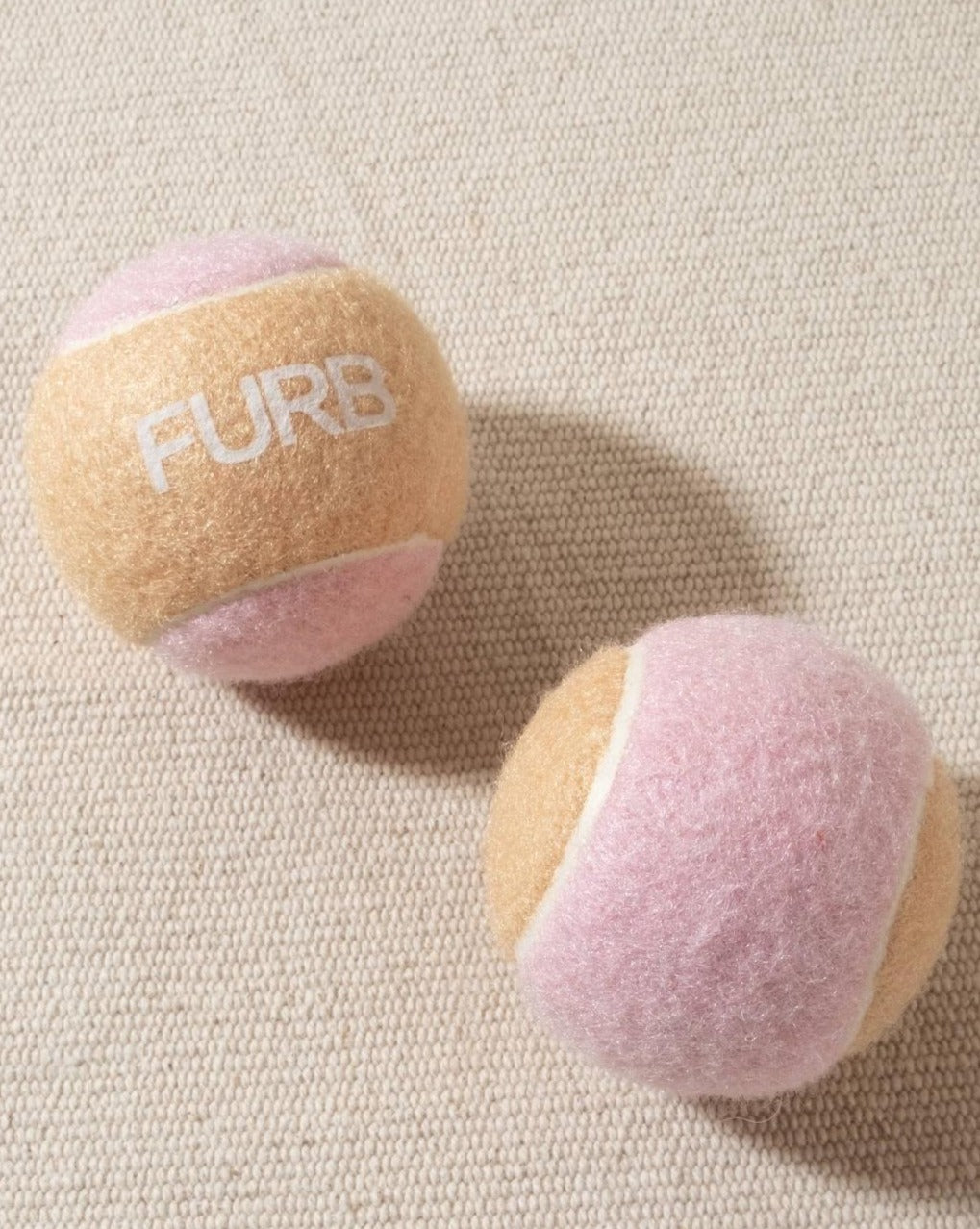 tan and blush tennis ball with white furb logo for dogs