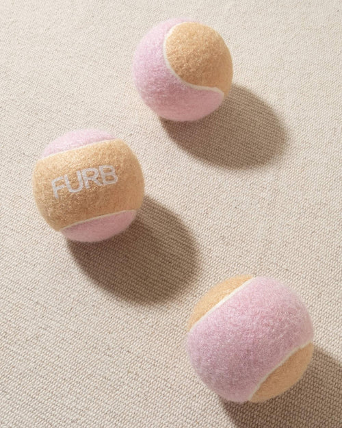 tan and blush tennis ball with white furb logo for dogs