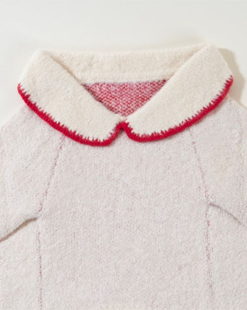 Cozy ivory sweater with a bow detail for your dog, great for cooler days.