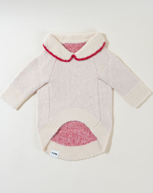 Classic ivory dog sweater with an adorable bow, ideal for a fashionable pup.