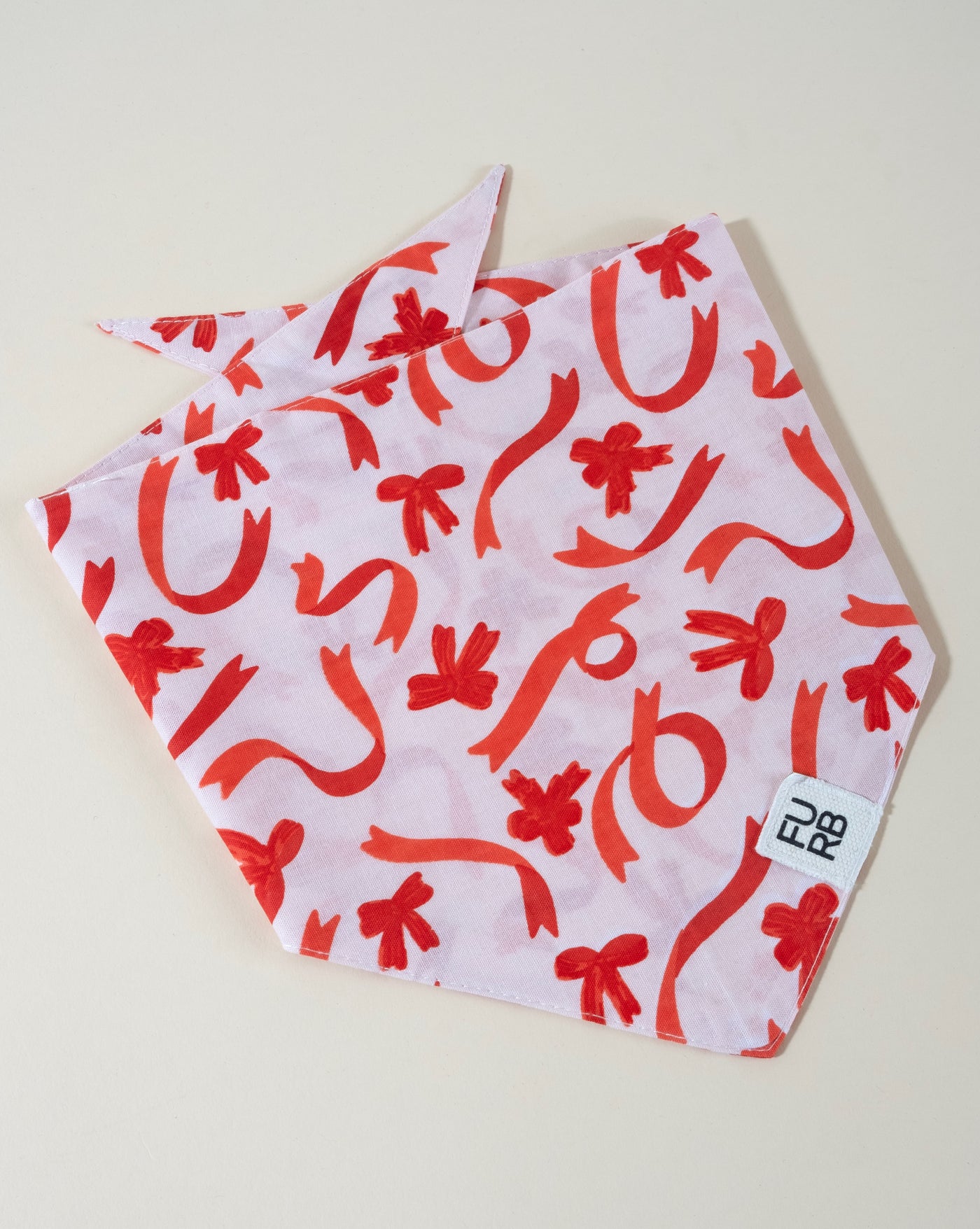 Holiday print dog bandana, ideal for your pup to wear during the season of giving.