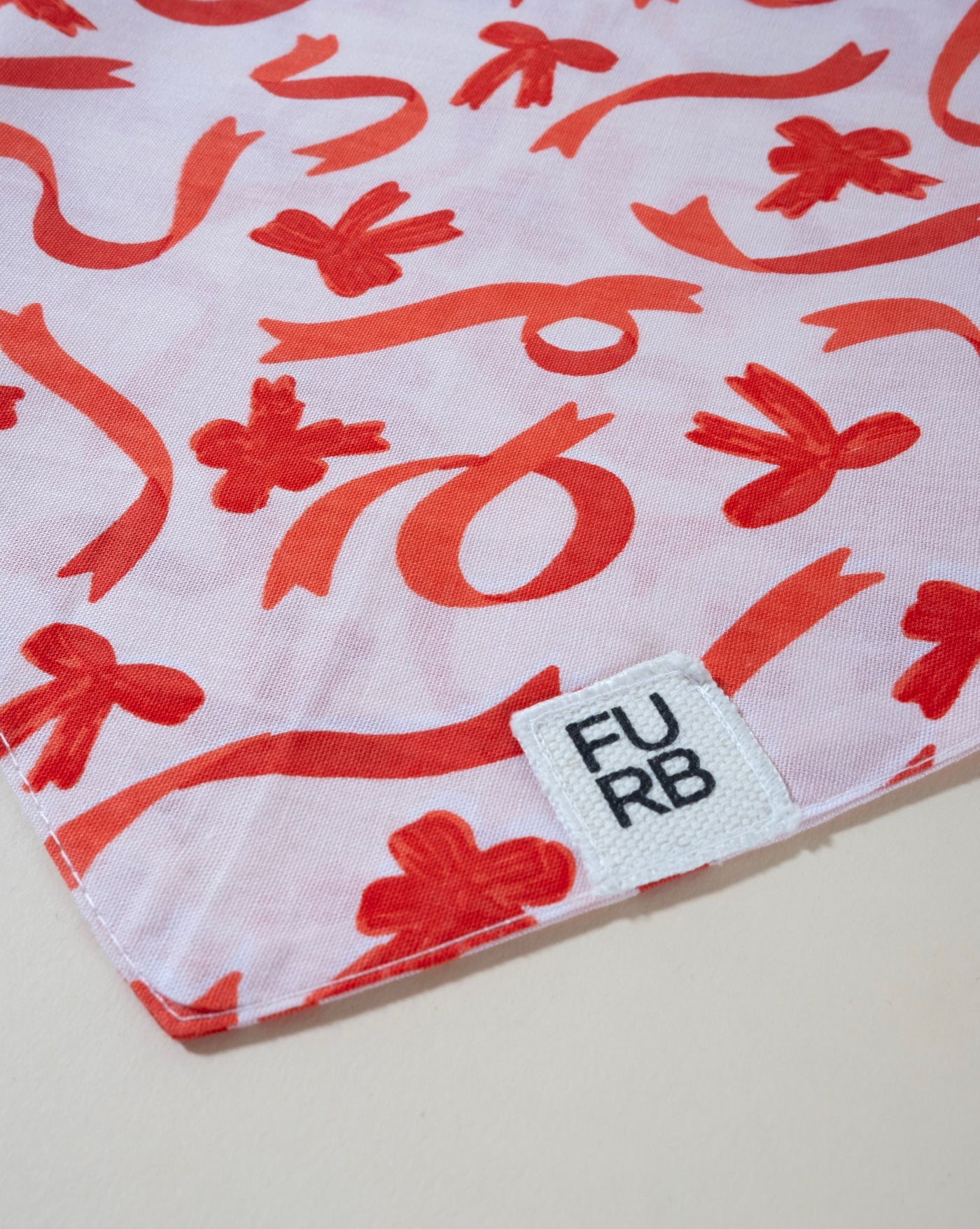 Perfect Present bow print dog bandana, ideal for holiday festivities.
