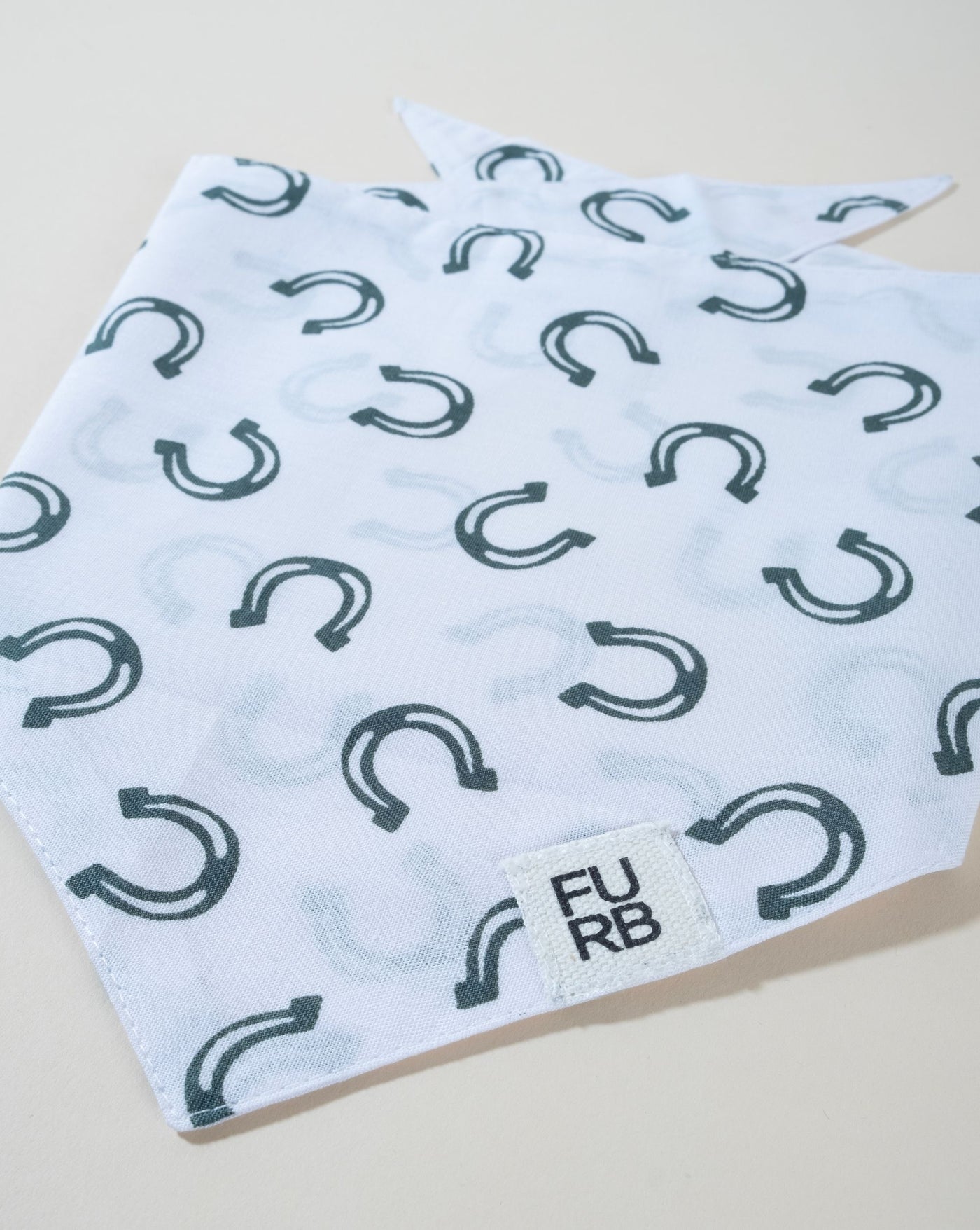 Lucky horseshoe dog bandana, perfect for keeping your pup stylish and lucky.