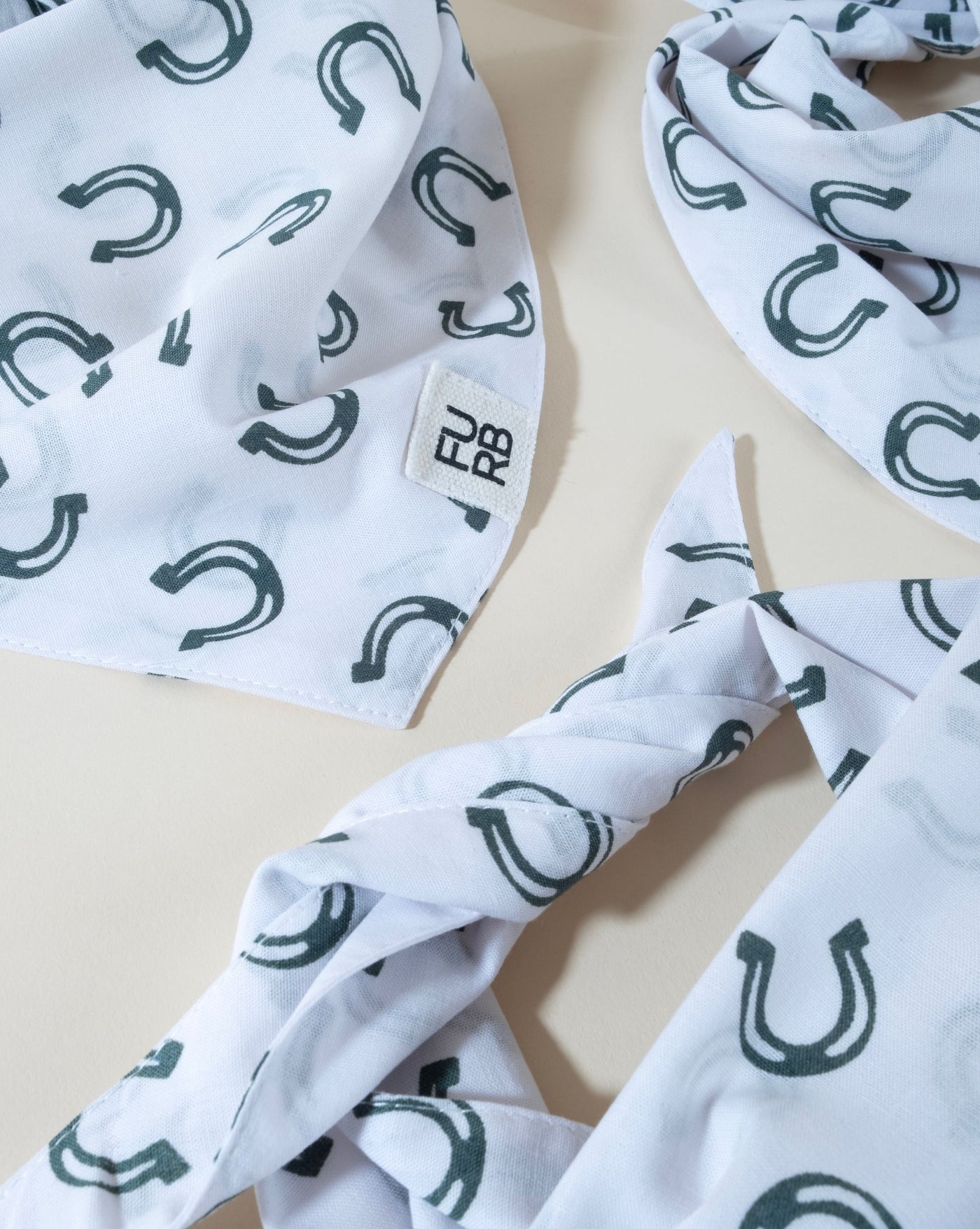 Charming horseshoe print dog bandana, great for any fashionable pup.