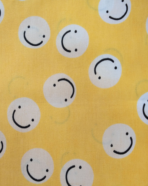 Smiley face yellow bandana for dogs, great for spreading positivity on walks.