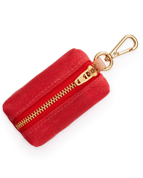 Stylish red poop bag holder with brass clasp, perfect for your dog’s daily walks.