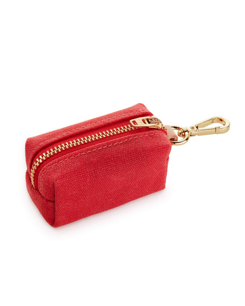 Red waxed cotton canvas dog poop bag holder with brass hardware, ideal for everyday walks.