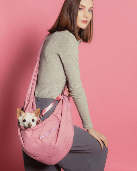 Maxbone Berry Sling Carrier in pink, designed for comfort and style while transporting your dog.