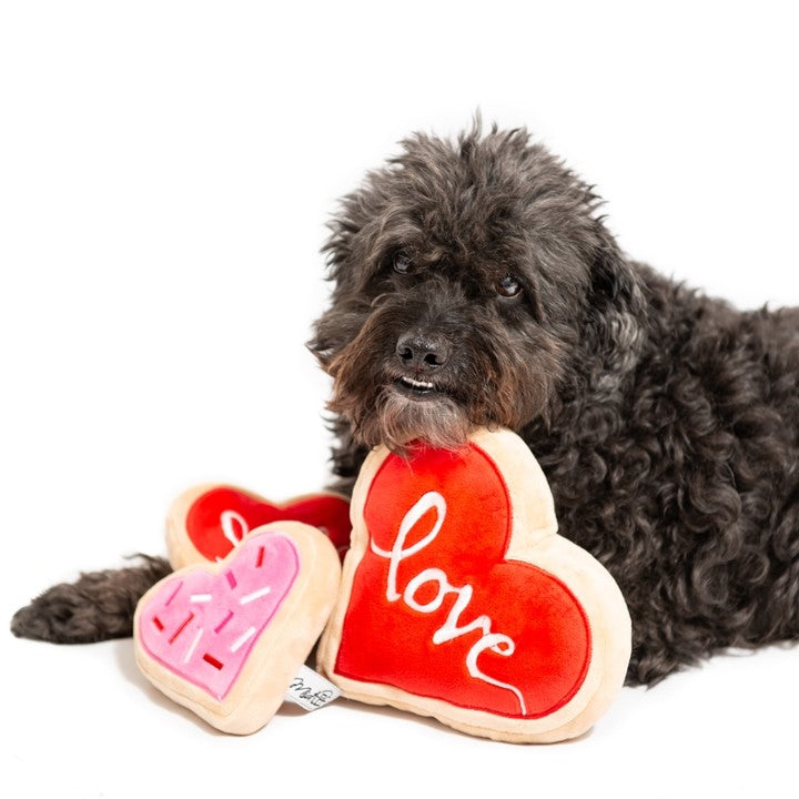 Valentine’s Day themed dog toy shaped like a sugar cookie.
Durable red sugar cookie dog toy with squeaker.