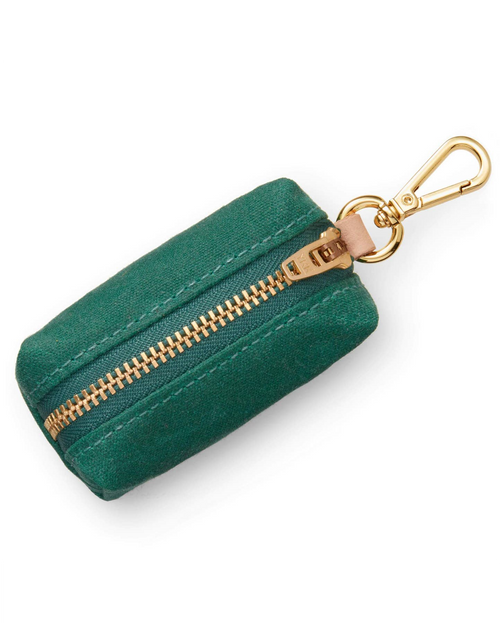 Waxed green cotton canvas is complete with elevated brass hardware. Sleek clasp easily attaches to your leash&