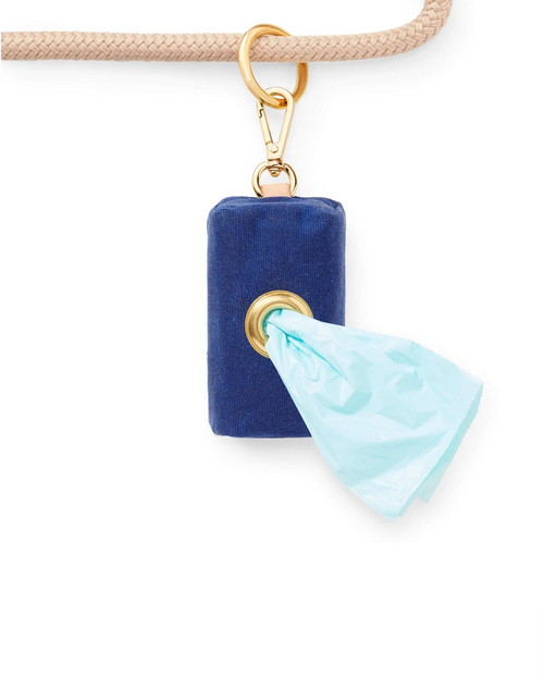 Waxed blue cotton canvas is complete with elevated brass hardware. Sleek clasp easily attaches to your leash&