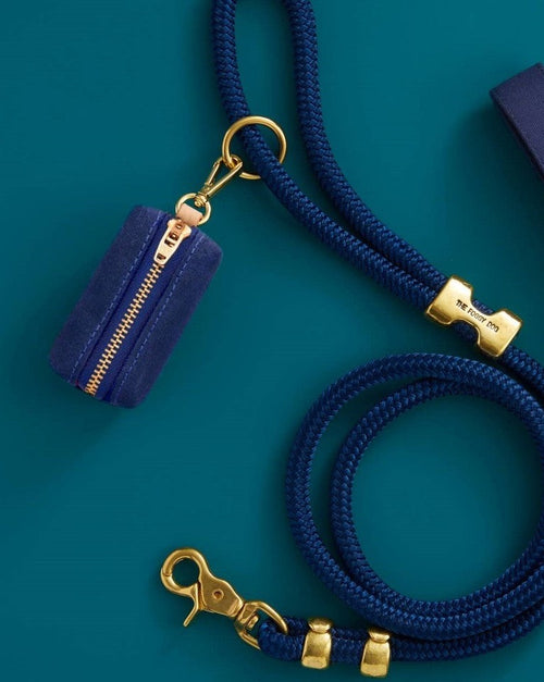 Waxed blue cotton canvas is complete with elevated brass hardware. Sleek clasp easily attaches to your leash&