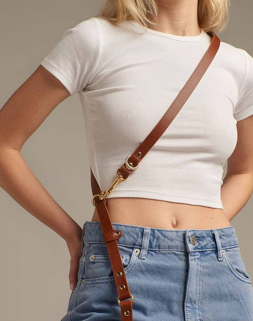 Reliable brown leather leash with multiple position adjustments for pets.