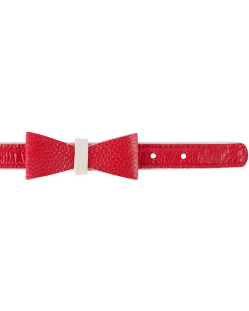 Chic red leather bowtie for pets, enhancing their fashion appeal