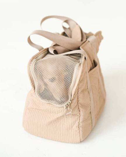 Sleek camel dog carrier bag, perfect for keeping your pup cozy and fashionable