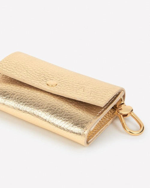 Stylish and practical gold leather waste bag holder, perfect for Dachshunds or Boston Terriers.