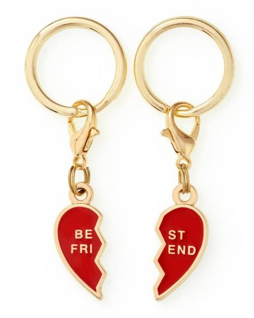 Matching heart-shaped BFF collar charms for small dogs, perfect for breeds like Dachshunds.