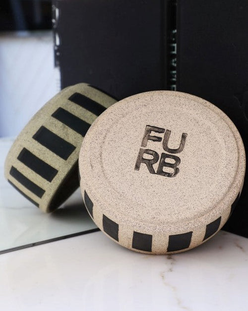 Each bowl is handmade with ceramic stonewear and striped, complete with a glaze to guarantee your pet eats and drinks safely. These bowls may vary in color and patinas, aging gracefully alongside your furry BFF.