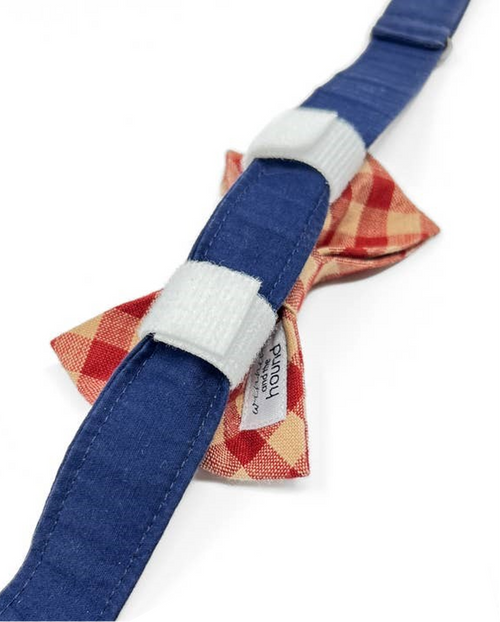 Stylish red and tan dog bow tie for a fashionable pup.