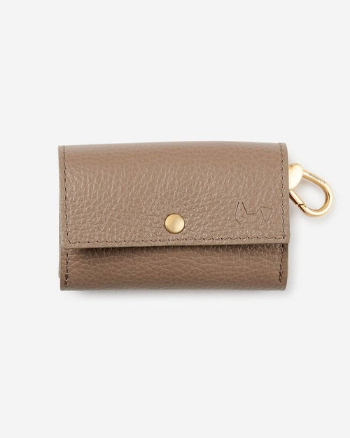 Taupe poop bag holder with gold zipper, blending functionality with modern design