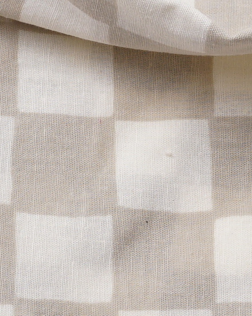 Sand checkered dog bandana with Furb logo, perfect for easy-going walks or fun outings.