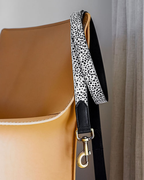 Angled shot of pony hair leash and tan leather dog collar, emphasizing premium materials and ergonomic design for comfortable walks